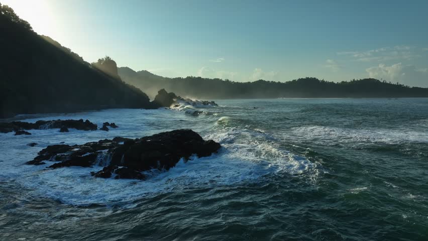 Dramatic Coastal Seascape with Waves at Sunset