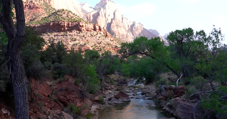 Zion National Park, Utah sandstone cliffs with creek flowing through