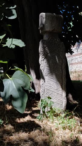 Ottoman Era Tombstone with Ancient Inscriptions in Istanbul. A historic Ottoman-era tombstone located in Istanbul, featuring intricate carvings and inscriptions in the old script. The text includes expressions of prayer and supplication to God, reflecting the spiritual and cultural depth of the period. A remarkable artifact that sheds light on Ottoman architecture, calligraphy, and historical heritage.