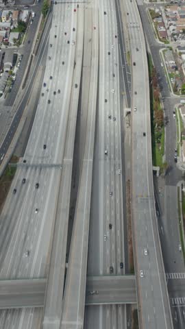 AERIAL: Slow Overhead Lookup over 110 Highway with little car traffic in Los Angeles, California on Cloudy Overcast Day 