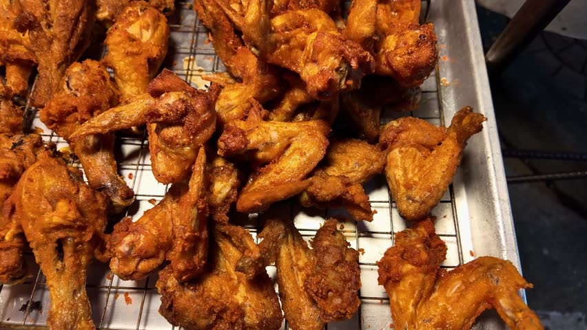 Crispy Deep Fried Chicken Wings and Drumsticks Street Food