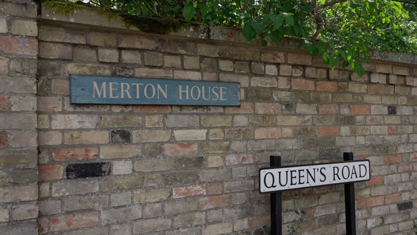Queen s Road street sign and Merton House sign on a brick wall in Cambridge, UK