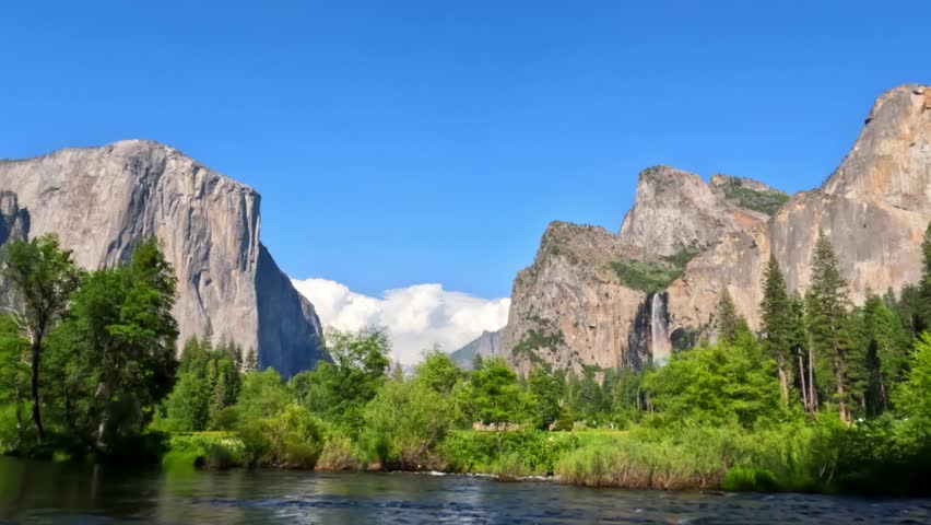 Beautiful view of Yosemite Valley featuring granite cliffs, waterfalls, forest landscapes, mountain scenery, and pristine wilderness in Yosemite National Park, California.