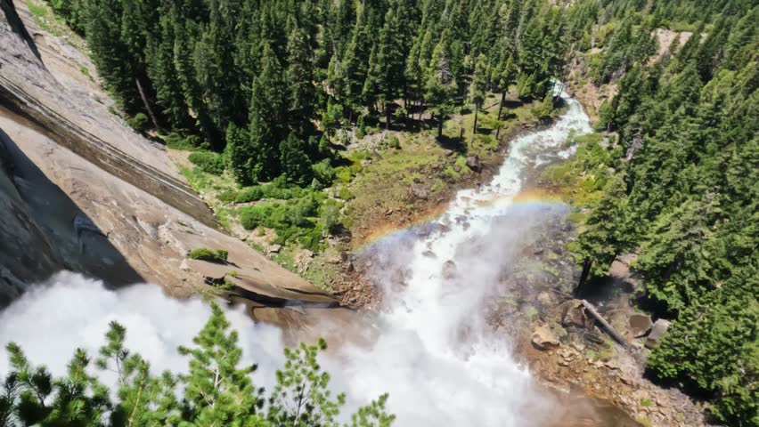  Breathtaking footage captured at the top of Nevada Fall, where the Merced River rushes across smooth granite before plunging into the canyon below