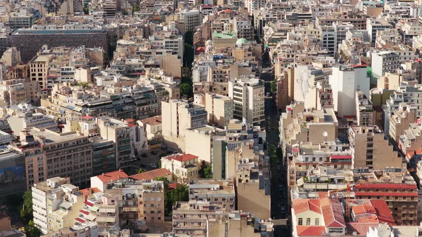 Athens high density building landscape displaying historic urban sprawl with residential districts on a sunny day spring or summer day