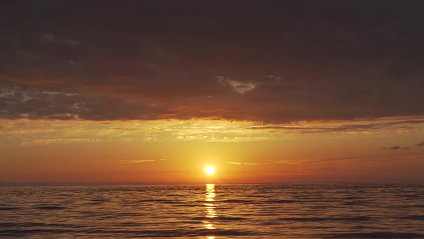 Beautiful bright sunset over the sea. Evening sea landscape.