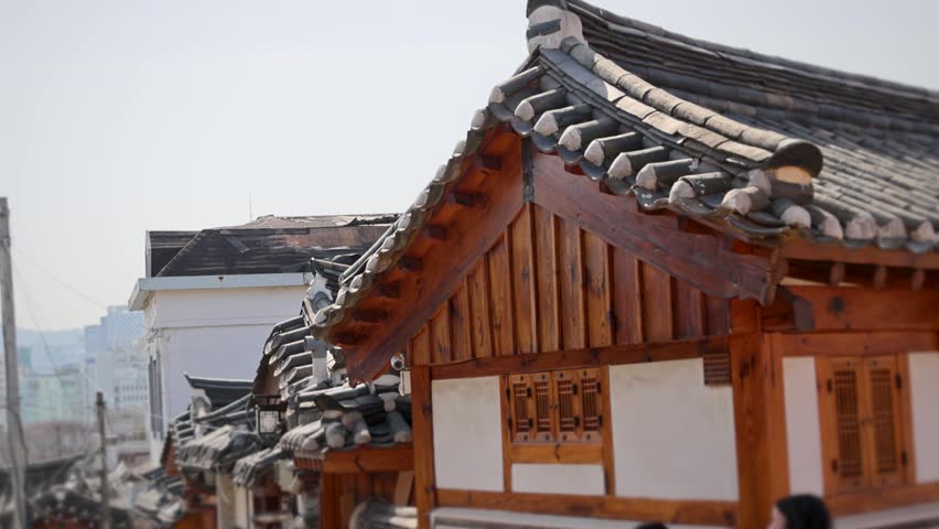 Seoul Hanok House Exterior With Tiled Roof And City View