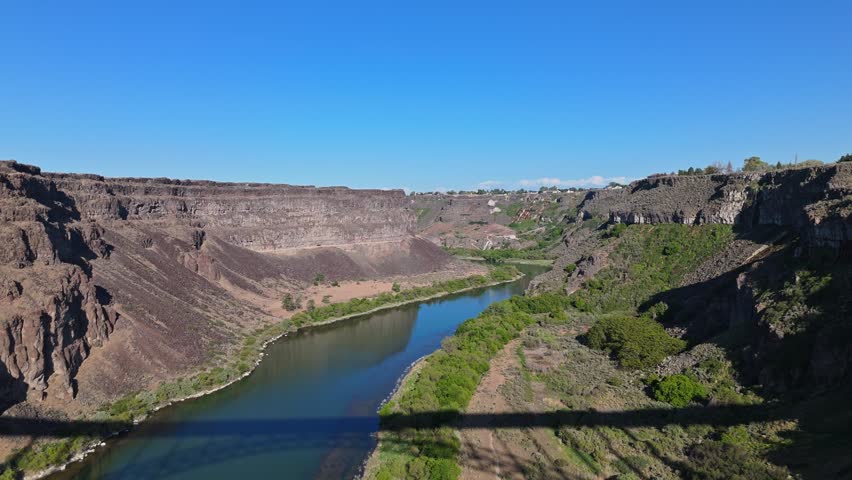 Aerial flyover shot of stunning Snake River in Twin Falls, Idaho on a sunny day in spring.
