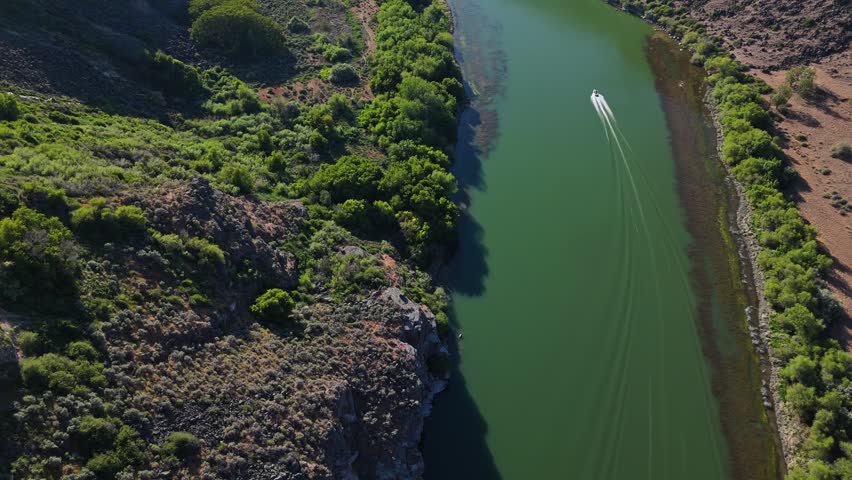 Aerial flyover shot of stunning Snake River in Twin Falls, Idaho on a sunny day in spring.