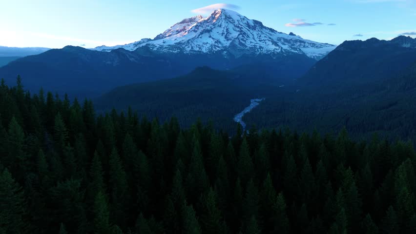 Twilight View Of Mount Rainier And Forested River Valley