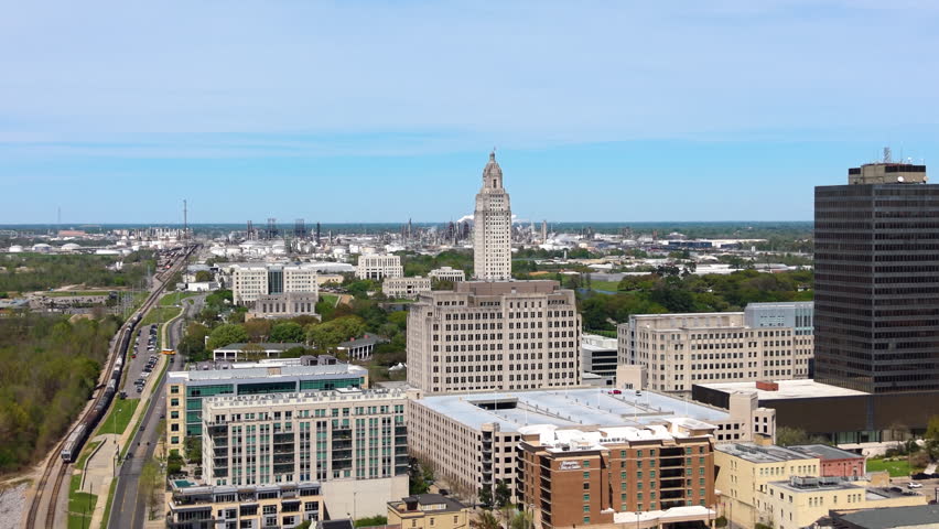 Aerial view of downtown Baton Rouge, Louisiana with historic buildings, modern skyline and the State Capitol near the Mississippi River.