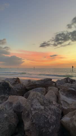 Rocky jetty breakwater at sunset on Tampa Bay Florida coastline