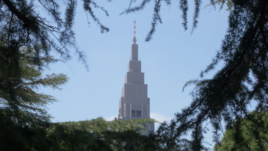 NTT Docomo Yoyogi Building In Shibuya, Tokyo, Japan As Seen From Shinjuku Gyoen National Garden. low angle shot