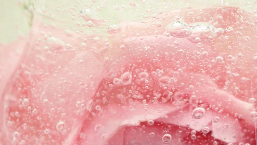 Pink serum gel background, cream, shampoo, macro soap bubbles, foam texture