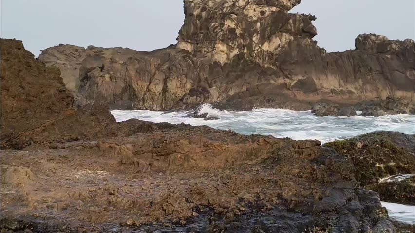 15 minutes of footage showing waves attemps to crash against the dry rocks at Cibobos Beach, Lebak, Banten, Indonesia.