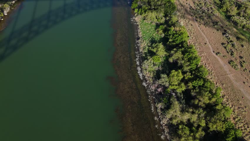 Cinematic aerial reveal of stunning Snake River in Twin Falls, Idaho on a sunny day in spring.