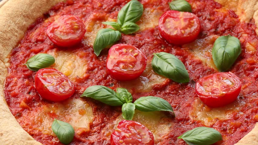 Yummy Margherita pizza on wooden table, spinning. Closeup view