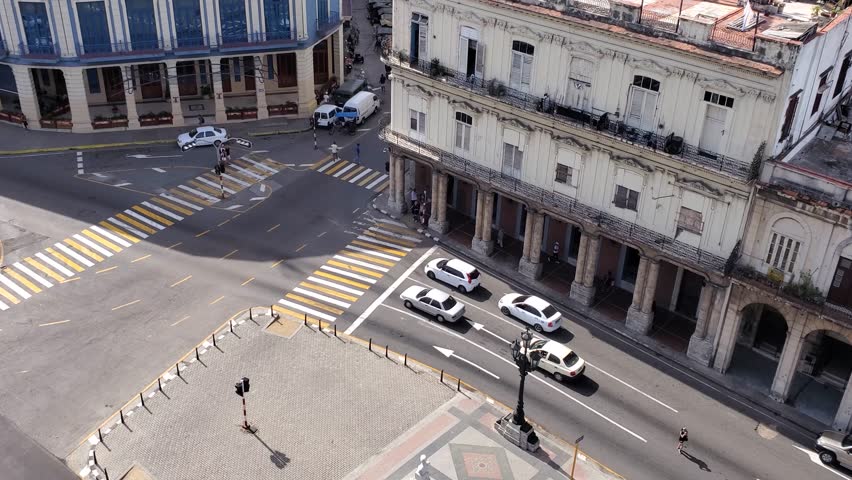 Aerial view of the historic Paseo del Prado with colonial architecture, busy street traffic, and crosswalks in Havana, Havana, Cuba.