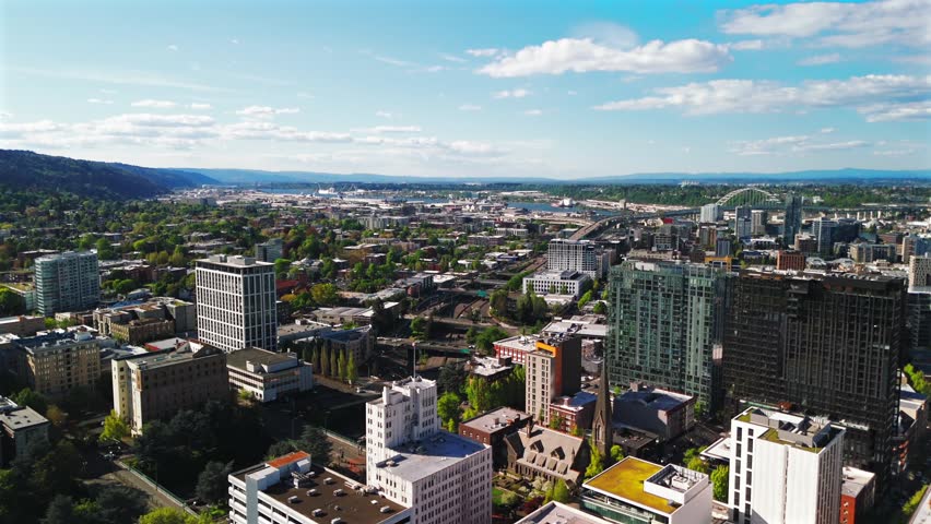 Portland Oregon Downtown Glass Tower Aerial View With Bridges and Lush Neighborhoods