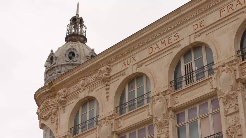 Vintage architecture building with arch windows in the main square of Narbonne, South of France.