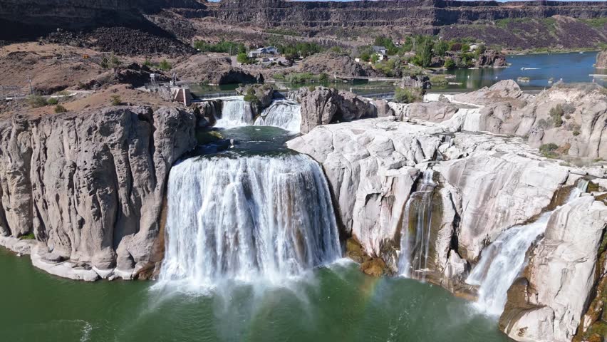 Aerial orbit shot of Shoshone Falls along Snake River in Twin Falls, Idaho on a sunny day in spring.