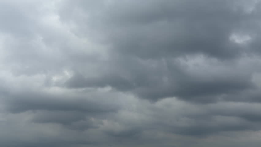 A quiet seaside landscape wrapped in thick clouds
