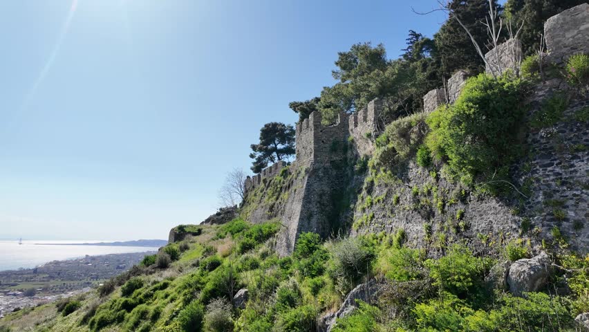 Nafpaktos, Aetolia Acarnania, Western Greece - March 15th, 2026 - aerial and street footage of the historical town, venetian harbor, venetian castle and fortress, clock tower, architecture, boats, former mosques, beaches and the landscapes around