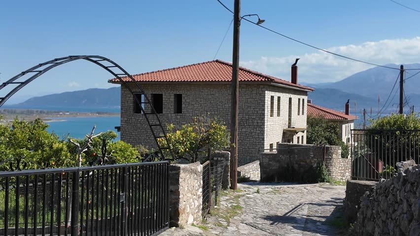 Nafpaktos, Aetolia Acarnania, Western Greece - March 15th, 2026 - aerial and street footage of the historical town, venetian harbor, venetian castle and fortress, clock tower, architecture, boats, former mosques, beaches and the landscapes around