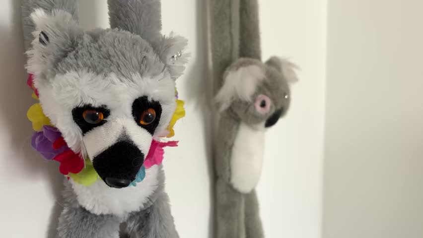 Stuffed Toy Animals Sitting Together on Bed in Cozy Home Interior