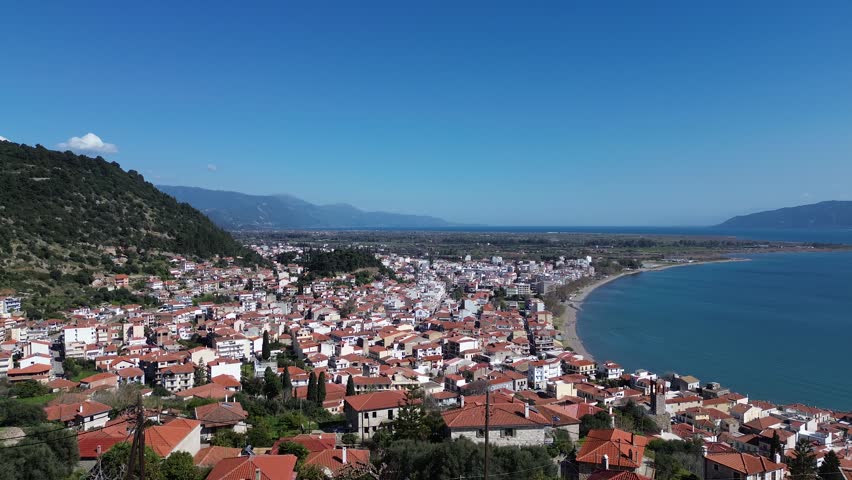 Nafpaktos, Aetolia Acarnania, Western Greece - March 15th, 2026 - aerial and street footage of the historical town, venetian harbor, venetian castle and fortress, clock tower, architecture, boats, former mosques, beaches and the landscapes around