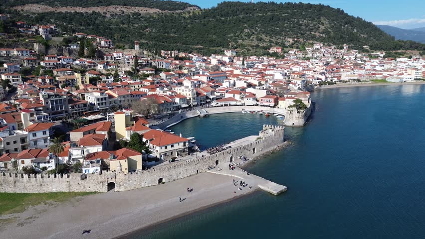 Nafpaktos, Aetolia Acarnania, Western Greece - March 15th, 2026 - aerial and street footage of the historical town, venetian harbor, venetian castle and fortress, clock tower, architecture, boats, former mosques, beaches and the landscapes around