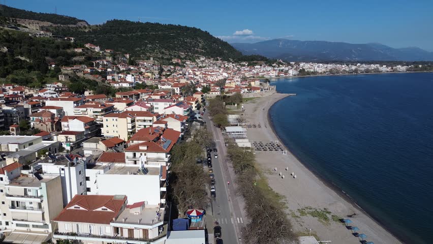 Nafpaktos, Aetolia Acarnania, Western Greece - March 15th, 2026 - aerial and street footage of the historical town, venetian harbor, venetian castle and fortress, clock tower, architecture, boats, former mosques, beaches and the landscapes around