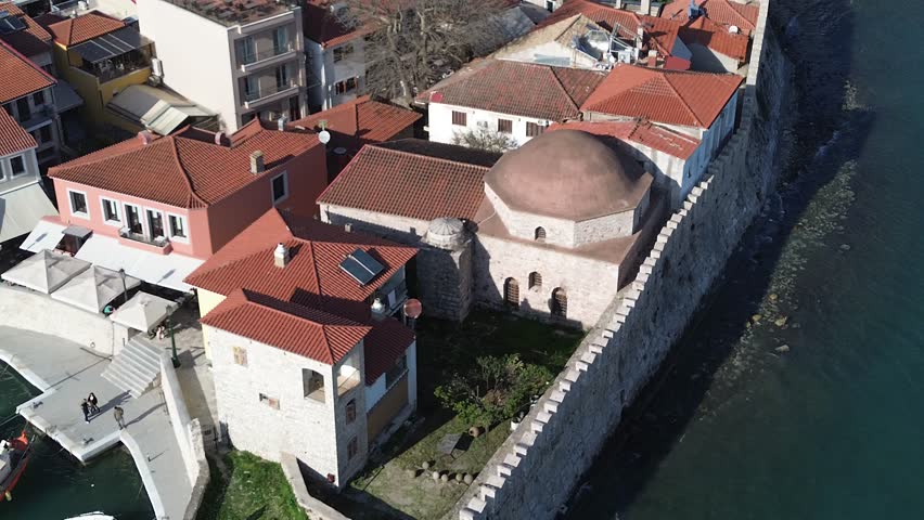 Nafpaktos, Aetolia Acarnania, Western Greece - March 15th, 2026 - aerial and street footage of the historical town, venetian harbor, venetian castle and fortress, clock tower, architecture, boats, former mosques, beaches and the landscapes around