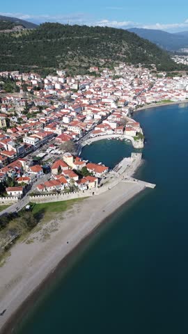 Nafpaktos, Aetolia Acarnania, Western Greece - March 15th, 2026 - aerial and street footage of the historical town, venetian harbor, venetian castle and fortress, clock tower, architecture, boats, former mosques, beaches and the landscapes around