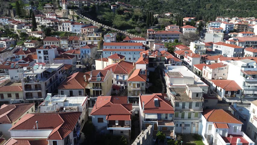 Nafpaktos, Aetolia Acarnania, Western Greece - March 15th, 2026 - aerial and street footage of the historical town, venetian harbor, venetian castle and fortress, clock tower, architecture, boats, former mosques, beaches and the landscapes around