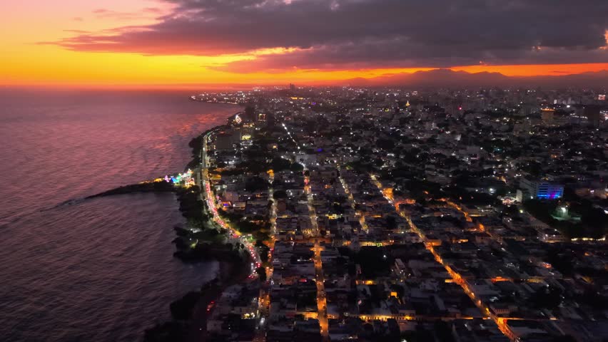 Cinematic aerial drone footage showcasing the beautiful sunset over Santo Domingo