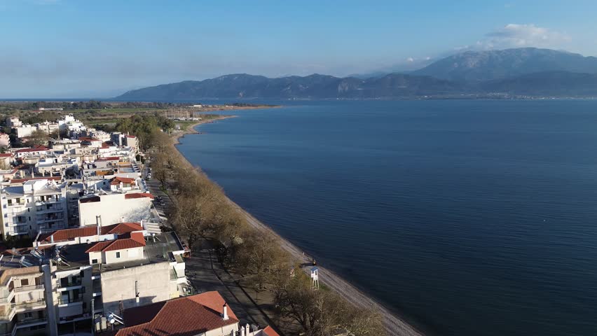 Nafpaktos, Aetolia Acarnania, Western Greece - March 15th, 2026 - aerial and street footage of the historical town, venetian harbor, venetian castle and fortress, clock tower, architecture, boats, former mosques, beaches and the landscapes around