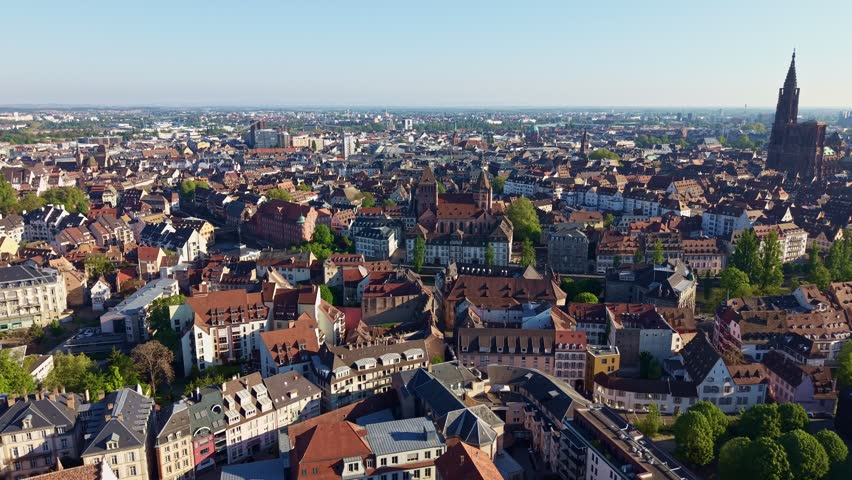 Historic city center and Notre Dame cathedral in Strasbourg, France. Aerial backward, cityscape