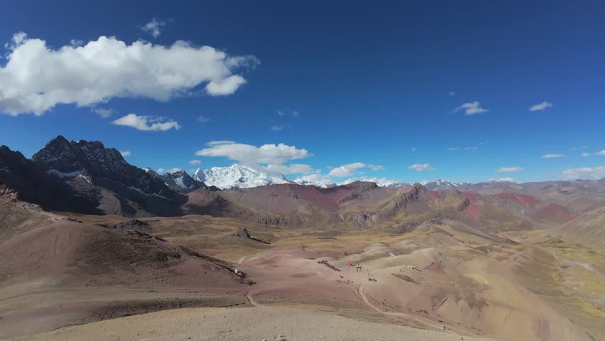 Panoramic View Of Vinicunca Rainbow Mountain And Peruvian Andes Under Blue Sky