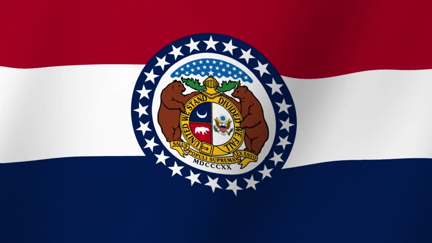 The flag of the state of Missouri waving in the wind with its official seal prominently displayed
