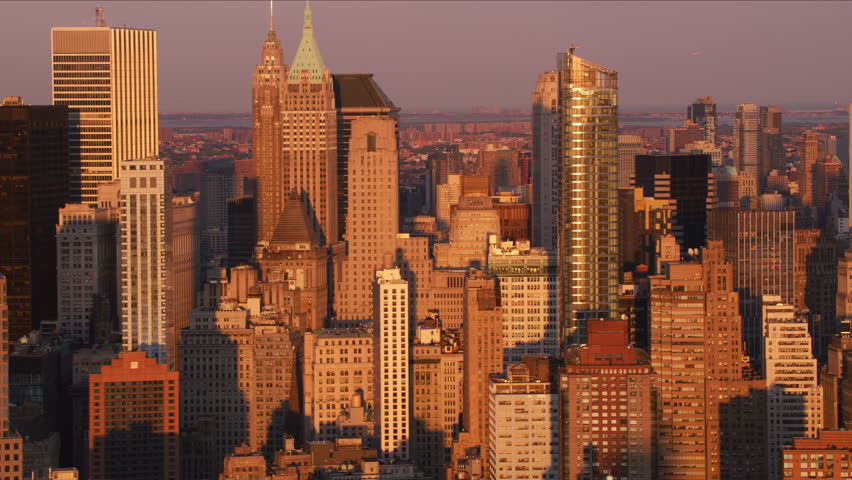 Aerial view of Manhattan skyline in New York City at sunset.  Shot from helicopter with stabilized gimbal with RED camera.