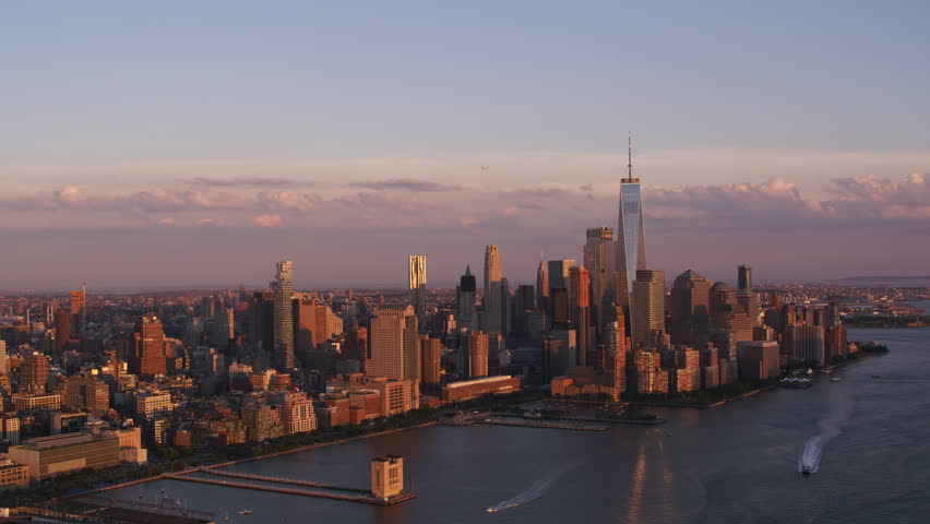 Aerial view of Manhattan skyline in New York City at sunset.  Shot from helicopter with stabilized gimbal with RED camera.