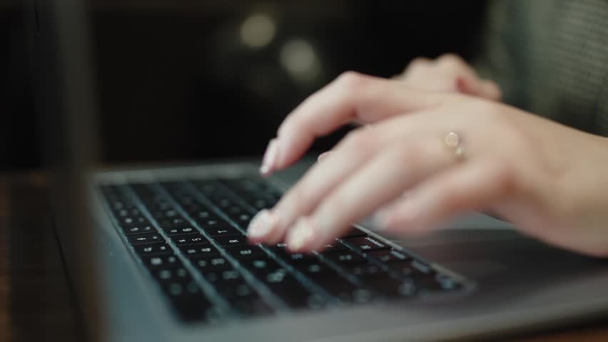 Close Up of Female Hands Using Laptop for Remote Work