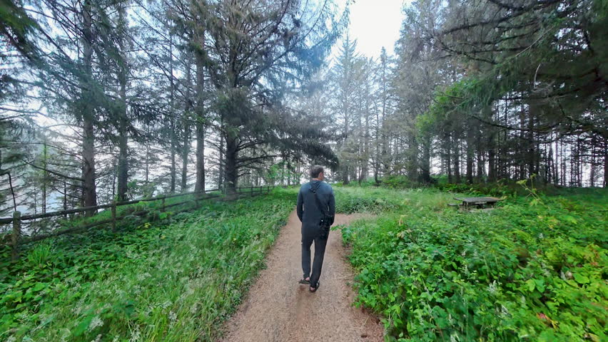 Man Hikes on Wide Trail in Samuel Boardman National Scenic Corridor along the Oregon Coast