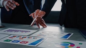 Concept of a group of business professionals holding a meeting in an office and digital technology. - Powered by Shutterstock - Get 15% off with code: PIKWIZARD15