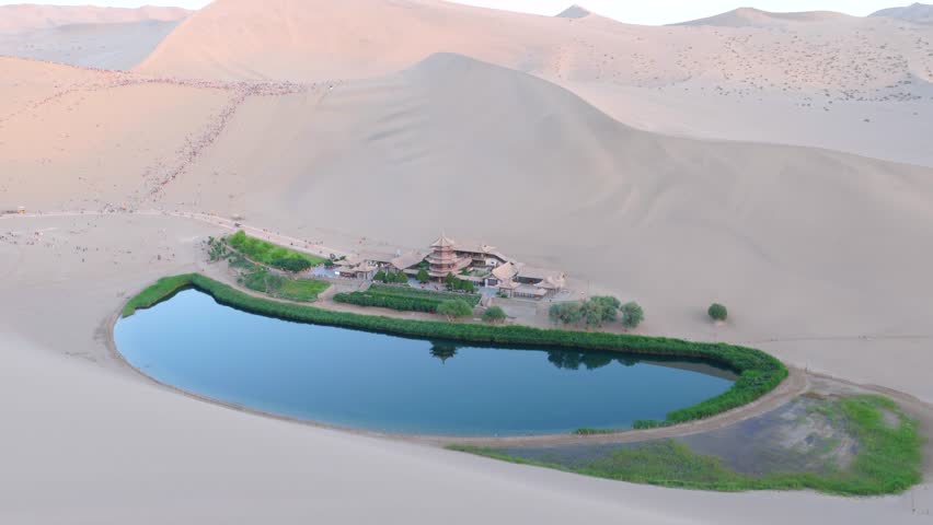 erial Drone Footage of Crescent Moon Spring, Mingsha Mountain Desert Oasis at Sunset, Dunhuang Gansu China
Panoramic Wide Shot of Dunhuang Crescent Lake Surrounded by Giant Sand Dunes, Ancient Chinese