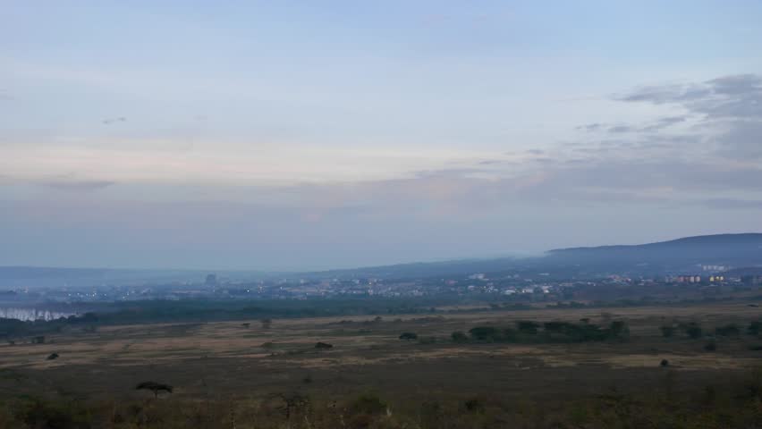 Scenic African wilderness panorama of Lake Nakuru shoreline at dawn, 4K