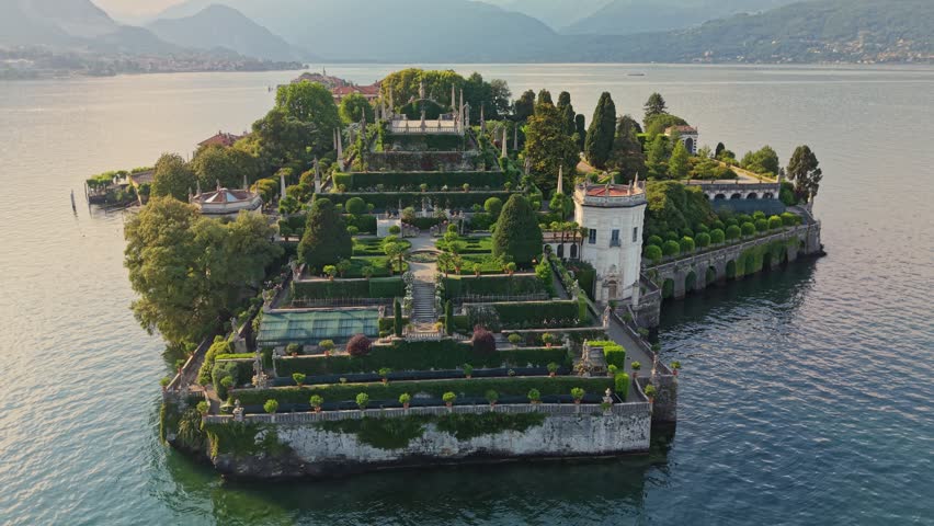 Aerial view of Isola Bella terrace gardens on Lake Maggiore, historic baroque architecture and green landscapes in Italy. Stunning Isola Bella palace garden with statues and manicured bushes