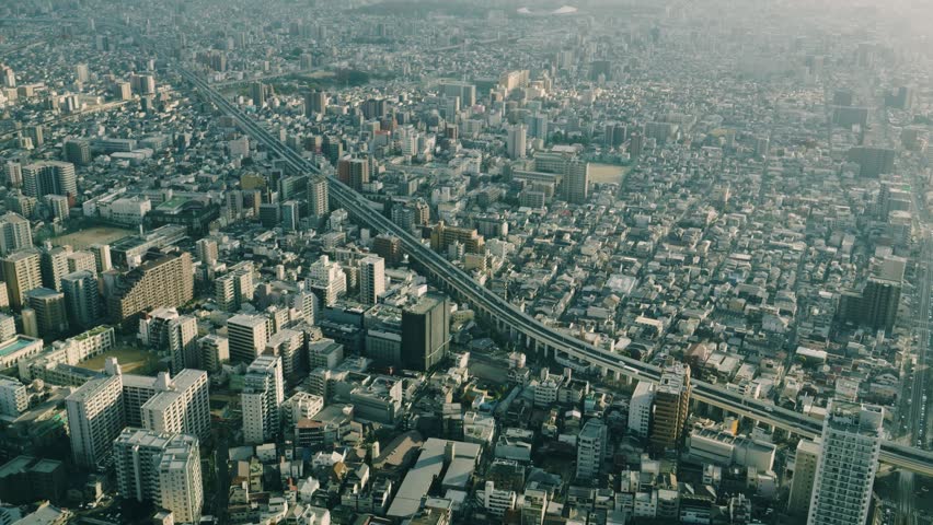 Osaka cityscape and dense urban buildings viewed from a high building in Japan