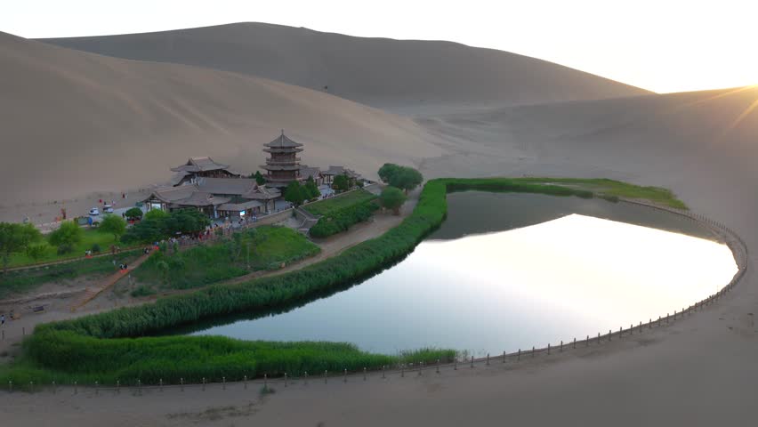 erial Drone Footage of Crescent Moon Spring, Mingsha Mountain Desert Oasis at Sunset, Dunhuang Gansu China
Panoramic Wide Shot of Dunhuang Crescent Lake Surrounded by Giant Sand Dunes, Ancient Chinese